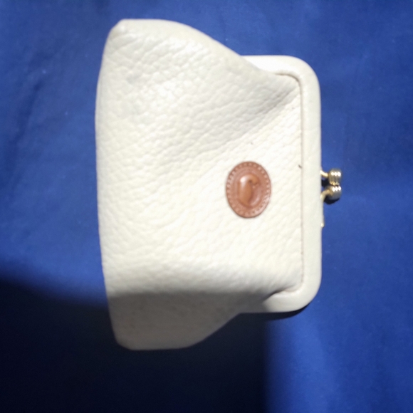 Dooney & Bourke Handbags - Dooney & Bourke White Leather Clutch